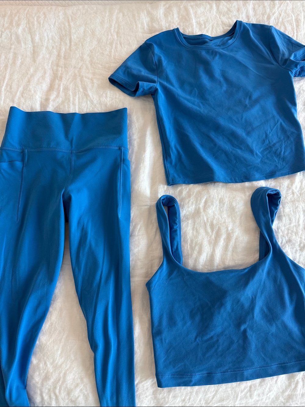 Athletes Salutation Stash leggings with pockets and matching tops
